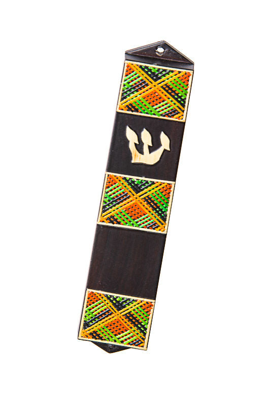 Dark wood mezuzah case with three green, orange and black straw panels and a straw Shin
