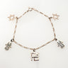Sterling charm bracelet laid flat with two Stars of David, two hamsas and a Hebrew Ahava charm