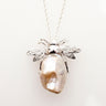 Silver bee pendant with sparkling CZ wings and a large baroque pearl body on a fine chain
