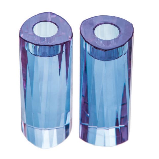 Top-angle view of triangular lavender crystal candlesticks showing candle wells and blue-violet facets