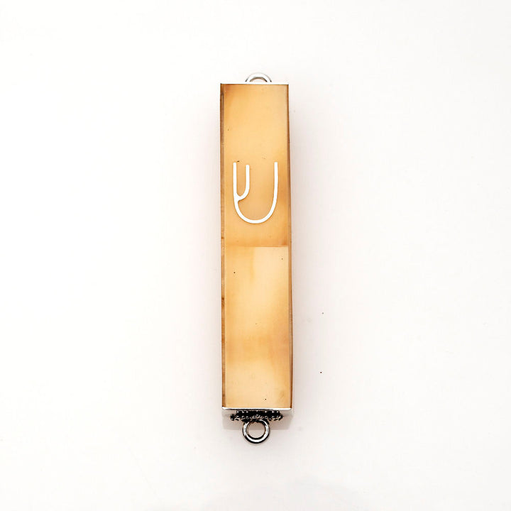 Mini mezuzah case with golden conch shell face, sterling silver frame and a silver Shin