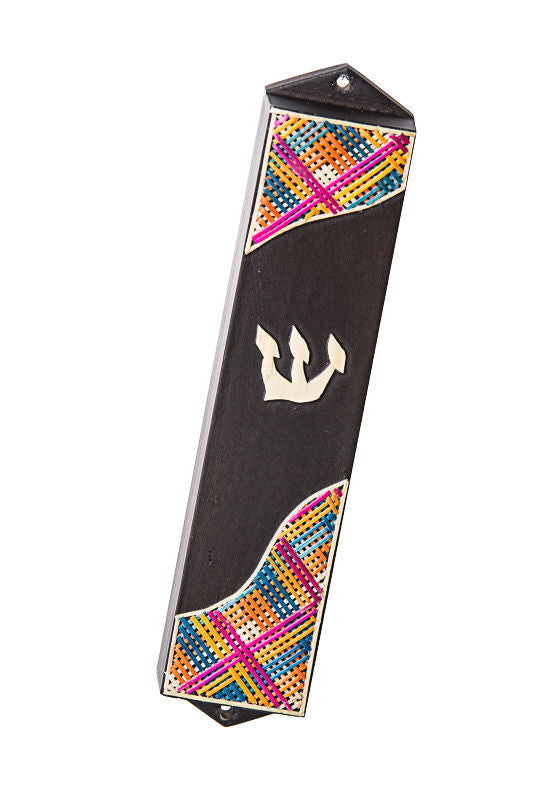 Dark wood mezuzah case with woven multicolor straw ends and a silver-tone shin