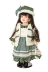 Elizabeth porcelain doll in green gingham dress, cream vest and green hat with bow, standing on a round stand