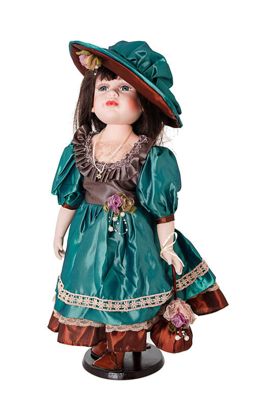 Abigail porcelain doll in teal satin dress and matching wide-brim hat with a small drawstring purse on a stand
