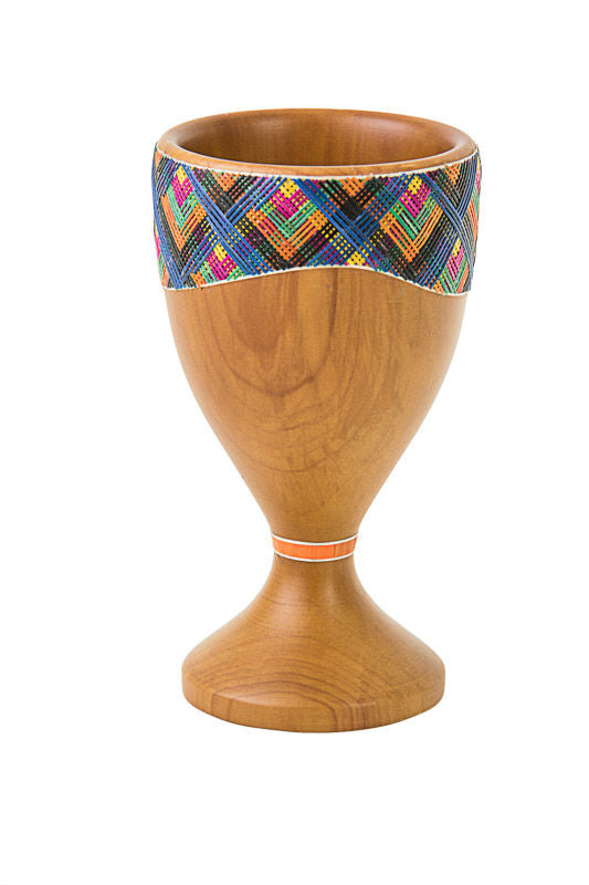 Light wood Reed Sea Miriam's cup with a multicolor straw band at the rim and an orange ring on the stem