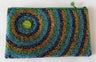 Beaded purse with concentric blue, gold and green rings around a green button accent