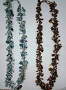 Two beaded necklaces shown together; the pale aqua and dark onyx strand at left is this item