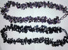 Two stone cluster necklaces on white; the lower black onyx and hematite strand is this necklace
