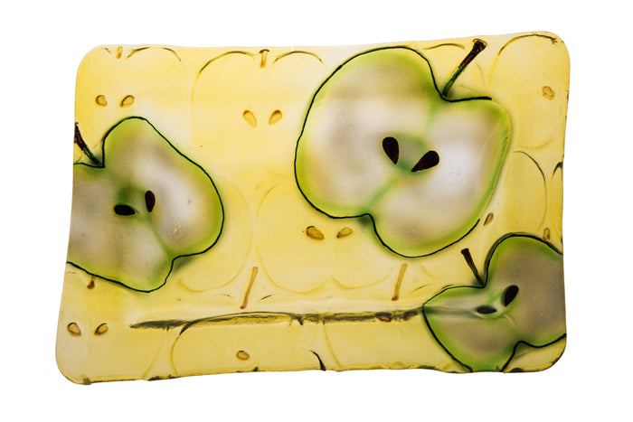 Rectangular glass platter with sliced green apple artwork on a yellow background