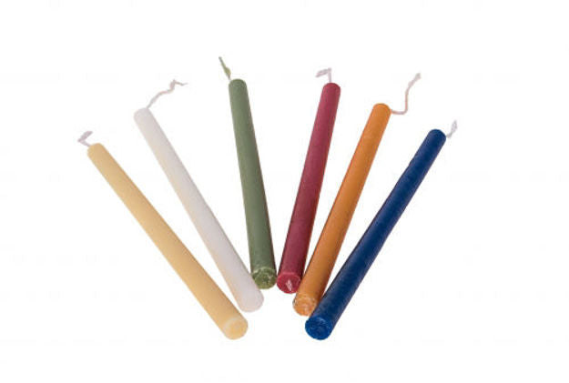 Six smooth multicolor Chanukah candles fanned out on white