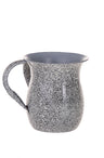 Rounded wash cup with speckled marble-look finish, flared rim and single loop handle