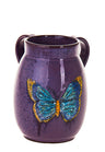 Eggplant purple stoneware wash cup with two handles and a blue and gold butterfly on the front