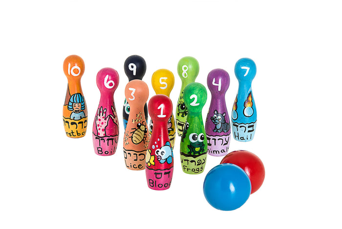 Ten painted plague bowling pins numbered 1 to 10 with Hebrew and English names beside red and blue balls