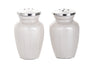 Pair of white enamel urn-shaped salt and pepper shakers with pierced silver-tone tops