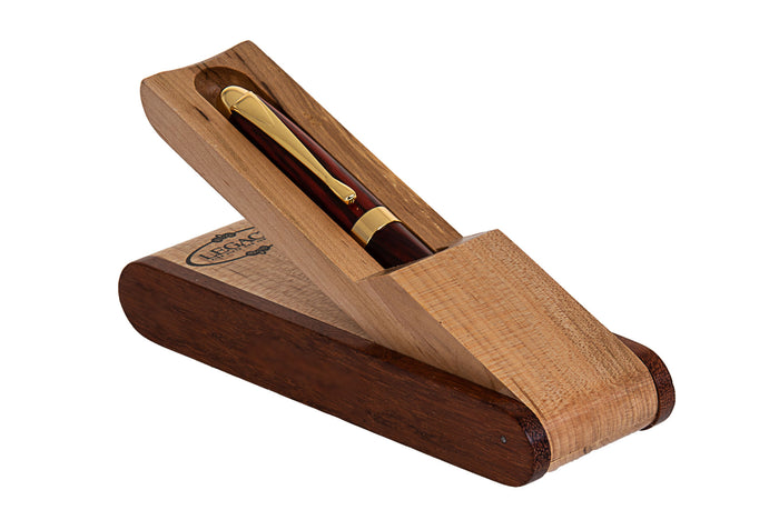 Wood pen with gold-tone trim resting in an open two-tone hinged wooden case