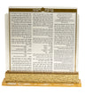 Clear Lucite bencher holder on a gold-tone base showing the Birkat Hamazon bencher cover