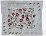White challah cover with embroidered red pomegranates on a branch, Hebrew text and leaf border
