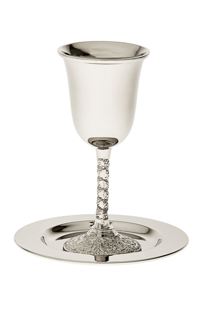 Polished stainless steel Kiddush cup with an ornate filigree stem standing on a smooth round tray