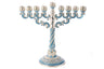 Chanukah menorah set with blue jewels across the frame and eight candle holders