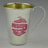 Silver plated baby girl cup with pink Hebrew lettering on an oval panel and a gold-tone interior
