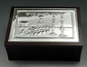 Dark wood bencher box with silver-tone lid showing Kiddush cup, challah and candlesticks