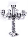 Nine-branch clear crystal candelabra with faceted column and curved arms on a square base