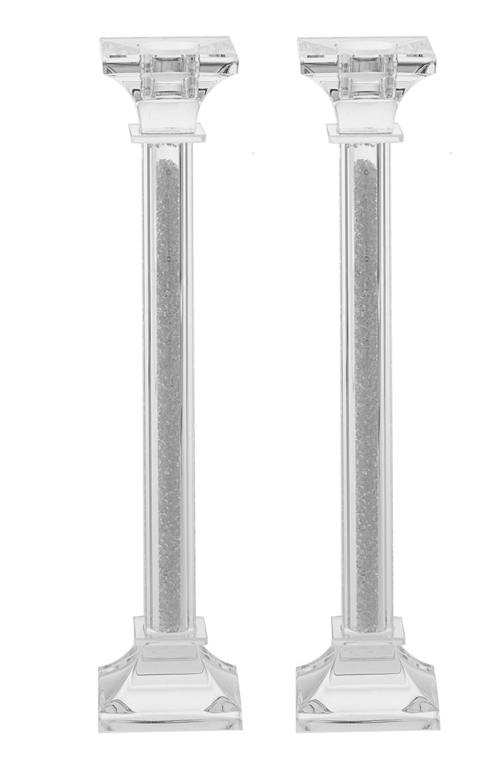 Pair of tall clear crystal candlesticks with crushed-stone columns and stepped square bases