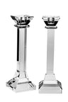 Two clear crystal square-column candlesticks with flared tops and stepped bases