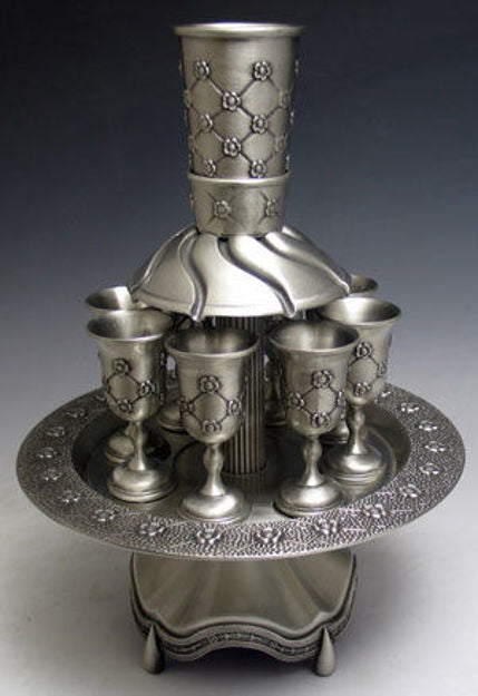 Pewter eight-cup wine fountain with lattice and rosette pattern goblets on a round rimmed tray