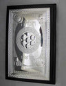 Leather Elias Haggadah with a sterling silver cover showing a seder plate relief and patterned border