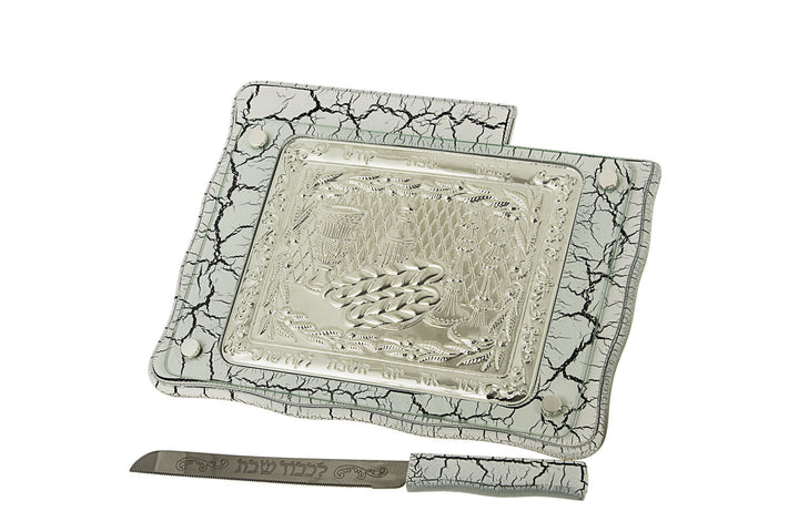 White marble-veined challah board with embossed silver-tone center and matching knife with Hebrew blade