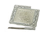 White marble-veined challah board with embossed silver-tone center and matching knife with Hebrew blade