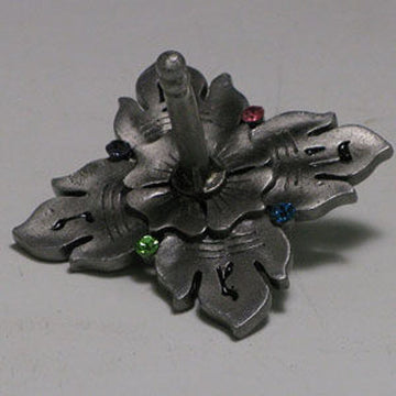 Grey pewter-finish dreidel with leaf-shaped points and small pink, blue and green stones