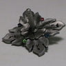 Grey pewter-finish dreidel with leaf-shaped points and small pink, blue and green stones