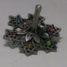 Pewter-finish dreidel made of cut-out Stars of David, each set with a colored stone