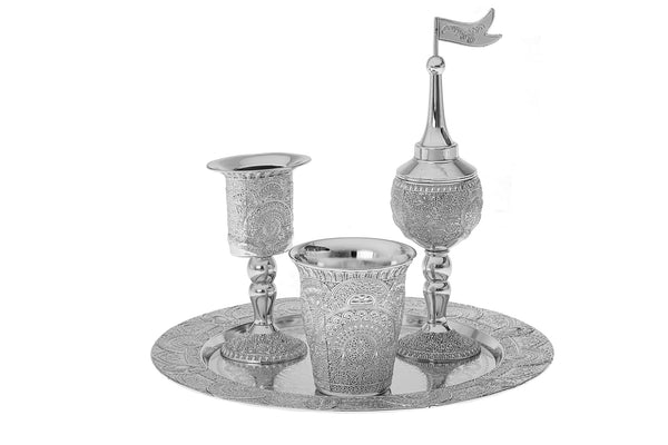 Silver plated havdalah set with the cup, spice box and candle holder standing together