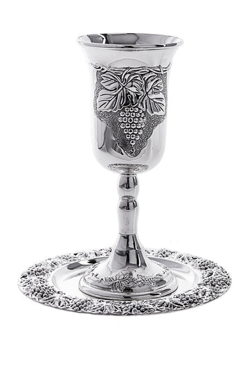 Silver-tone Elijah goblet with raised grapes and vine leaves on a tray with a grapevine border