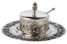 Silver plated honey dish with grapevine relief, clear liner, finial lid and spoon on a grape-rimmed tray