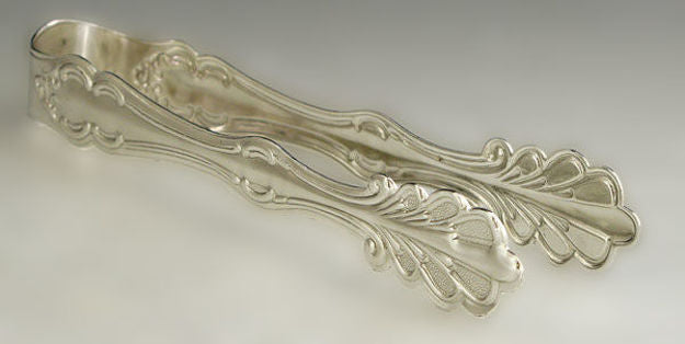 Silver plated ice tong with scrolled openwork arms and fan-shaped grips