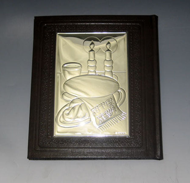 Brown tooled leather Zemiros with a sterling silver panel showing Shabbat candles, challah and a Kiddush cup