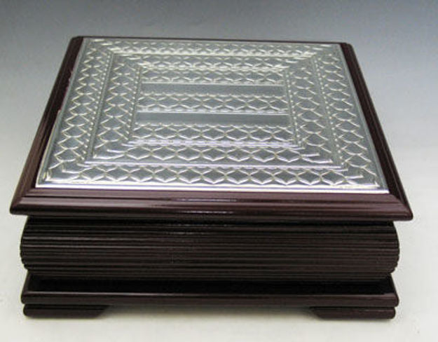 Square dark wood tea box with a sterling silver lattice-pattern lid and a footed base