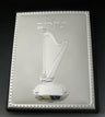 Leather Tehillim with a sterling silver cover showing a harp under the Hebrew title and a beaded border