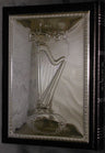 Leather-bound Tehillim with a sterling silver harp cover and Hebrew title, spine visible at right