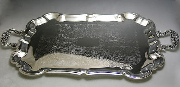 Silver plated tray with scalloped rim, engraved floral center and ornate cast handles