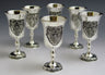 Six silver plated stemmed liquor goblets, each with a raised grape cluster panel