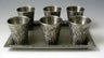 Set of six Jerusalem-relief liquor cups on a matching rectangular tray, silver plated listing