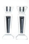 Pair of clear crystal candlesticks with dark tapered inset panels edged in a beaded border