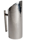 Tall hammered stainless steel pitcher with an angled spout and a straight bar handle