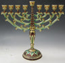 Jeweled menorah with pale green gold-edged leafy arms, burgundy column and leaf-decorated round base