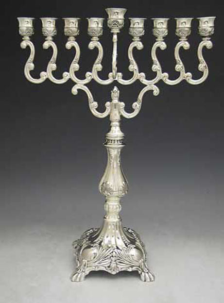 Silver plated menorah with S-scrolled arms, ornate cups and a footed shell-decorated base